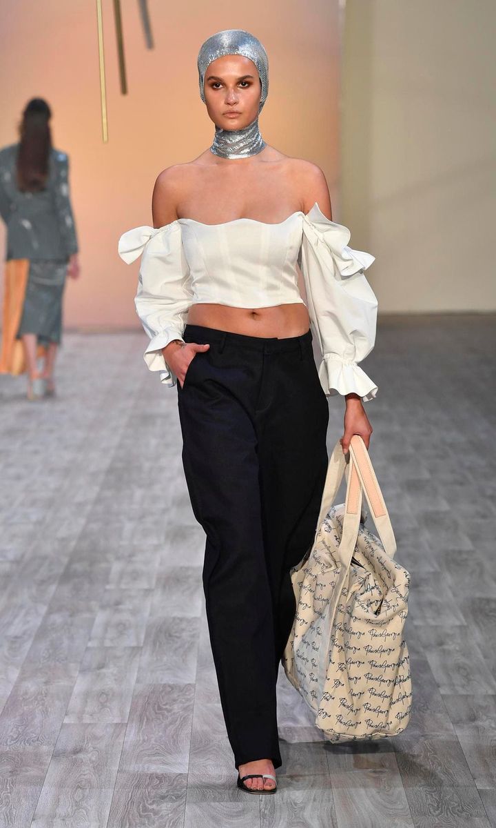 Model with black plants and white top at New Zealand Fashion Week 2019