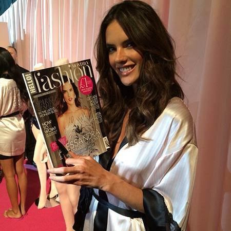 Alessandra Ambrosio with her copy of this month's HELLO! Fashion Monthly.