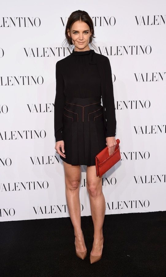 Katie's head-turning ensemble: chic and effortless with a pop of Valentino red.