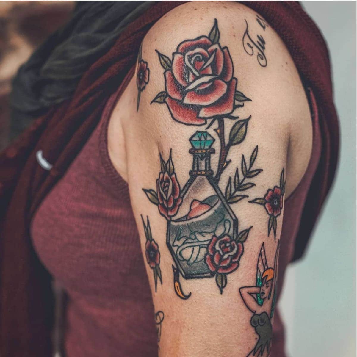 Arm rose tattoo
