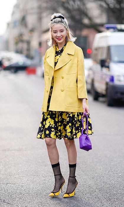 Yellow is one hot shade in Paris! Here's a stylish Irene Kim who added a pop of purple to her sunny combination.
Photo: Getty Images