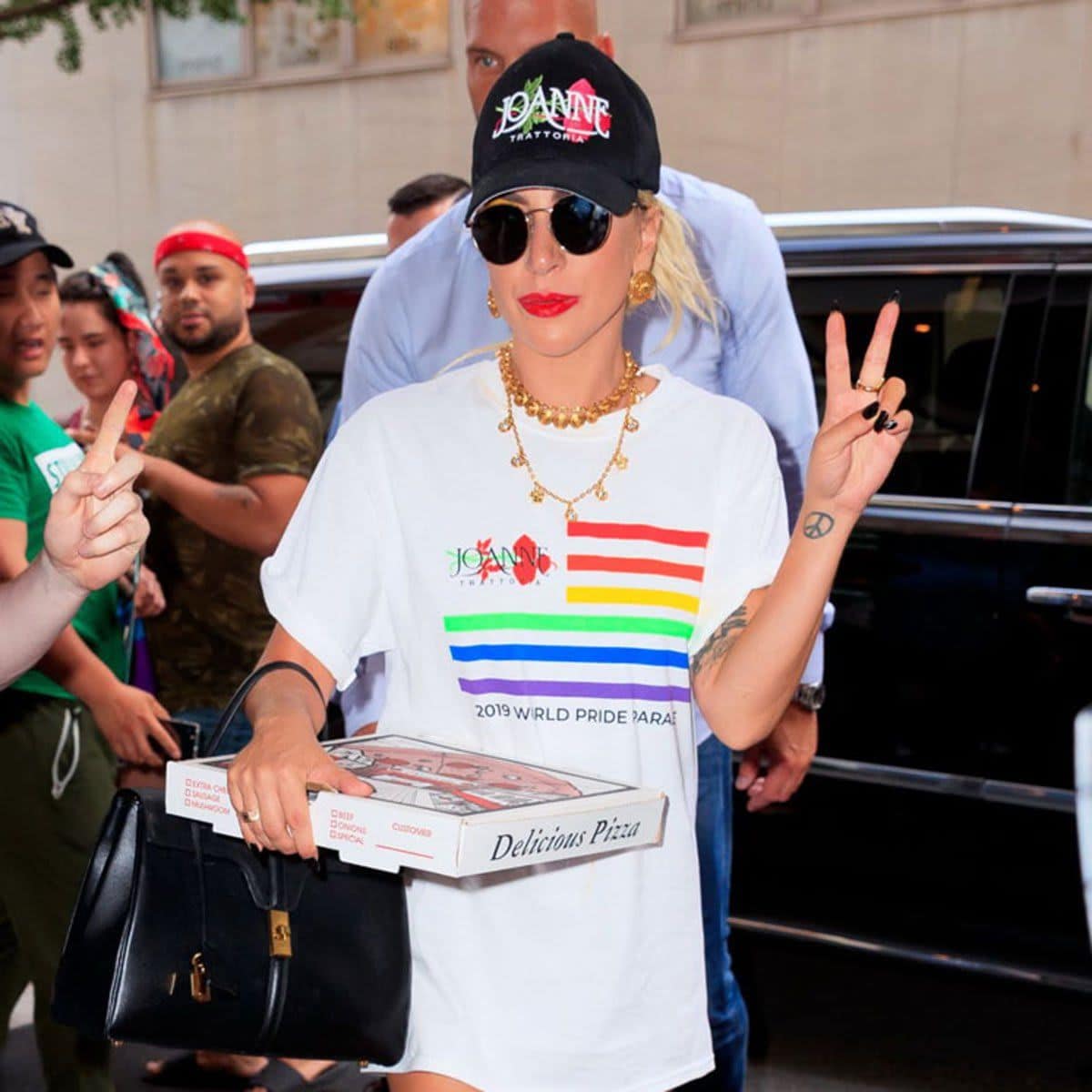 Lady Gaga carrying a pizza box