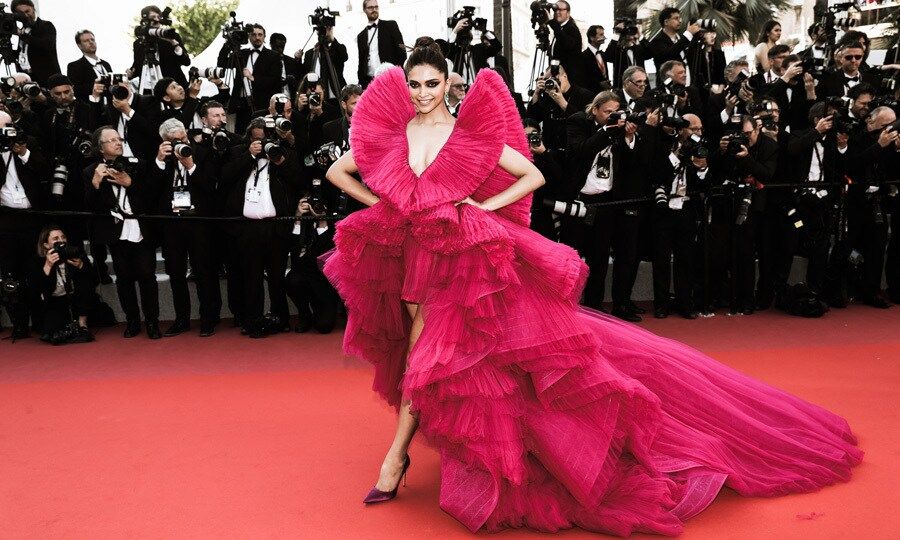 Deepika Padukone made a statement on the <i>Ash is Purest White</i> Cannes red carpet in a magenta gown by Ashi Studio.
Photo: Getty Images