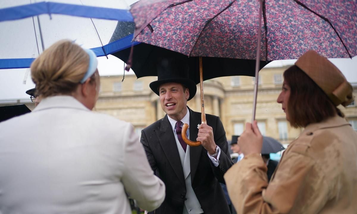 William held an umbrella as he greeted and chatted with guests. "A pleasure meeting so many wonderful people from across the UK at today's garden party ," the Waleses' Instagram account captioned a video from the event.