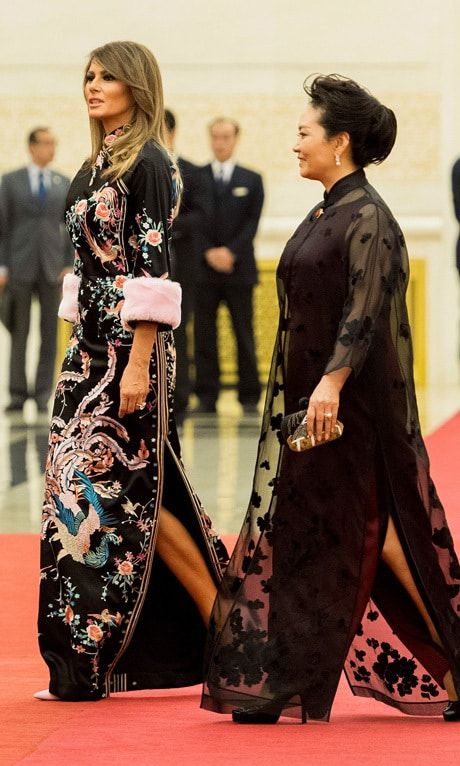 The first lady changed later in the day for the state dinner held at the Great Hall of the People. Melania stunned wearing a Chinese-inspired dress by Gucci. The floral number features an embroidered mandarin collar and pastel pink fur cuffs. Barron Trump's mother straightened her hair for the dinner on November 9.
Photo: JIM WATSON/AFP/Getty Images