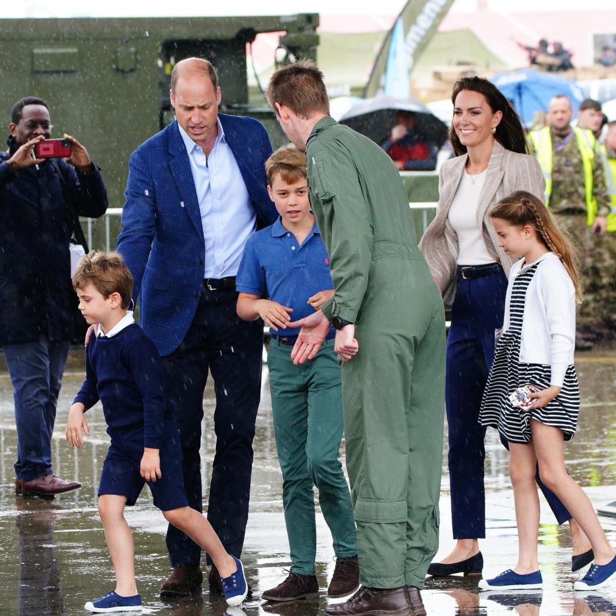 The rain didn't appear to bother the royals during their family outing.