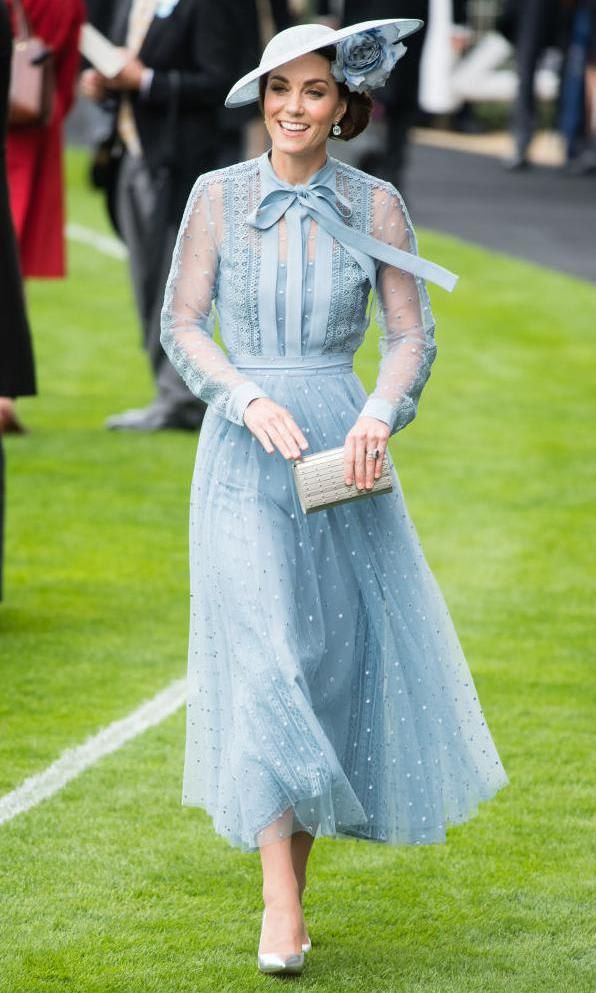 Kate Middleton in a light blue tulle dress with sheer sleeves