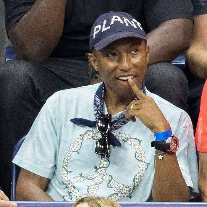 Pharrell Williams inquisitively looked on during a tennis match in Queens.
Photo: Team GT/GC Images