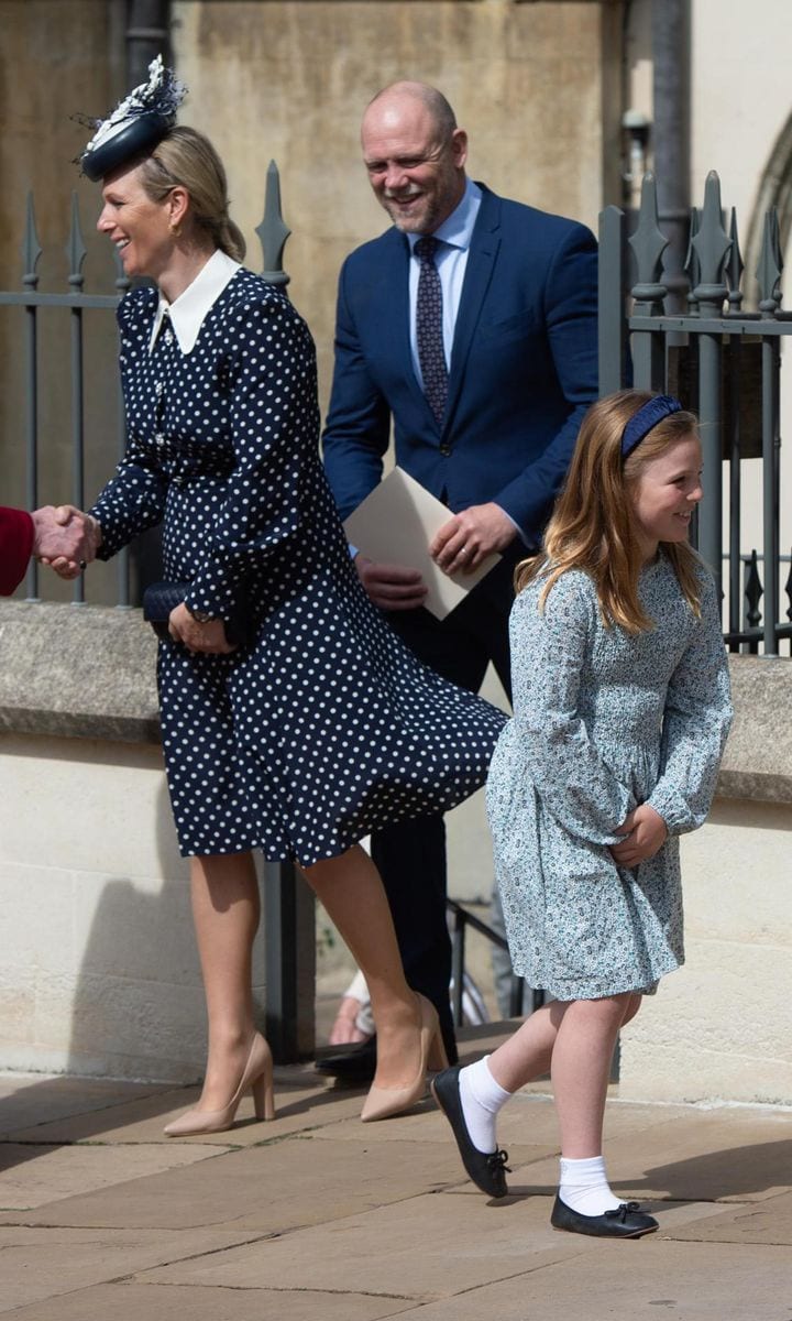 Mia, sporting a printed dress and headband, got a head start leaving the church ahead of her parents.