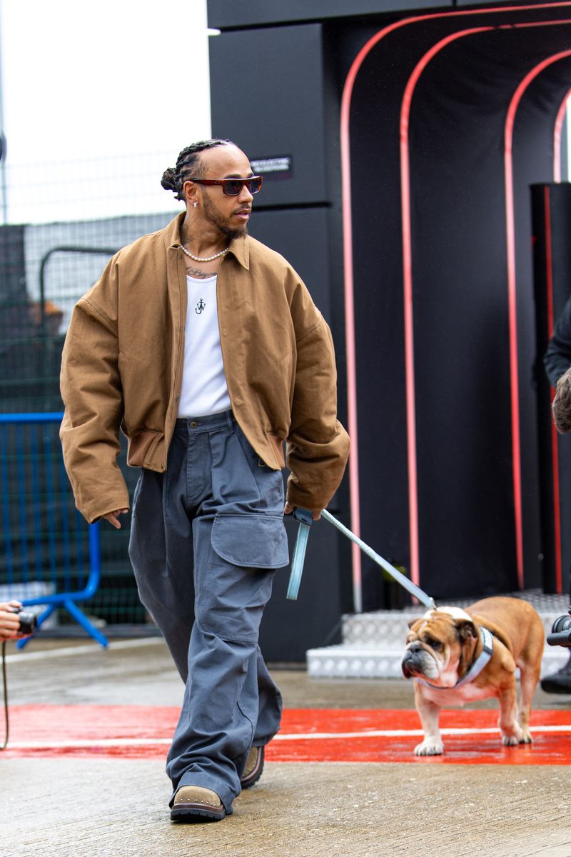  Lewis Hamilton of Great Britain and Mercedes arrives in the paddock with his dog Roscoe during practice ahead of the F1 Grand Prix of Great Britain at Silverstone Circuit on July 5, 2024 in Northampton, United Kingdom.