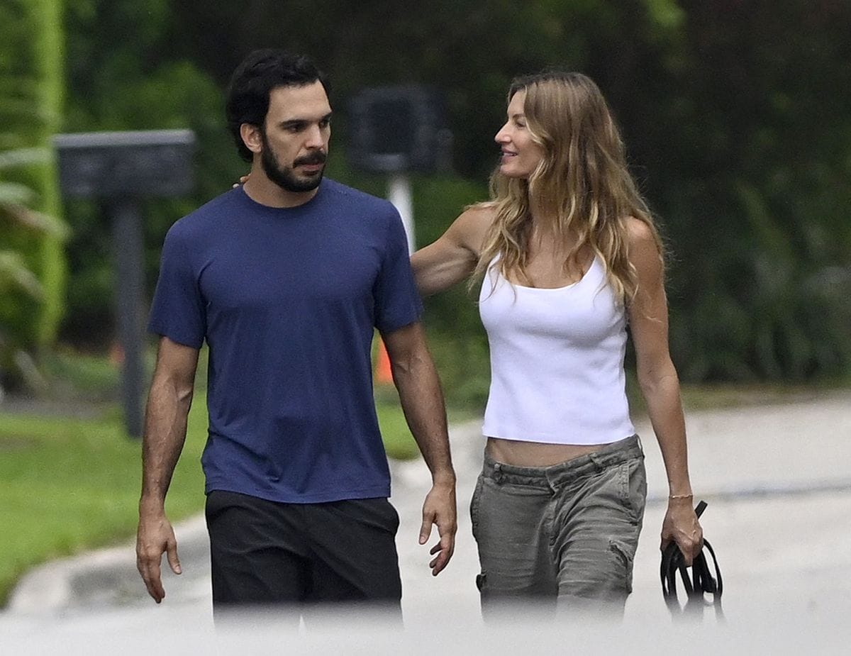 Gisele Bundchen and handsome boyfriend Joaquim Valente put on a loved-up display as they walk the dogs in Surfside, Florida. In fact, such is the strength of their relationship, Valente has moved into the supermodelâs $11.5 million newly-renovated Miami mansion, debunking false rumors of a split. Breakup speculation around the catwalk queen and her jiujitsu trainer boyfriend, 36, could not be further from the truth, as these exclusive photos show the Brazilian-born lovebirds have taken their romance to the next level by setting up home together. These stunning aerial images reveal the newly renovated dream home, where the two have been staying together, in all its glory having undergone a huge facelift. Nestled in a ritzy neighborhood just across Biscayne Bay from ex-husband Tom Bradyâs newly-built mansion, the 43-year-oldâs sleek two-storey property boasts a glistening pool, sprawling sundeck and freshly resurfaced balcony off the master bedroom. A new roof and floor-to-ceiling windows were also part of the contemporary makeover, which has spanned 18 months. Further disproving reports that their love affair was over, these aerial shots clearly show Valenteâs truck parked in the driveway of the residence. And debunks claims that their affair was âfizzling outâ amid stress sparked by public attention and Bradyâs brutal Netflix roast. These images prove the duo are still firmly an item although they have been staying low key and not been pictured together in months. Gisele is known to have been traveling to and from her native Brazil in the wake of her motherâs recent death. She had splashed out on the Surfside fixer-upper in November 2022 while NFL legend Brady kept the ambitious new construction they had originally started together just a stoneâs throw away on Indian Creek Island, dubbed âBillionaire Bunkerâ. During her own renovation project, Gisele had been staying at a different pad cl