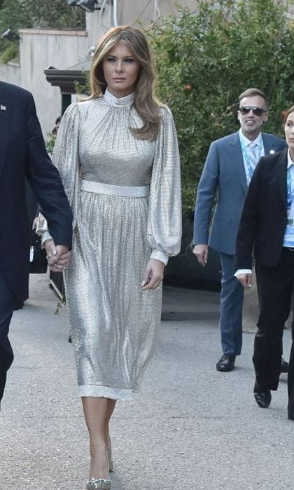 Melania Trump stepped out in her second Dolce & Gabbana dress of the day in Taormina. The first lady wore this t-length shimmery dress with billowy sleeves to a concert of La Scala Philharmonic Orchestra at the ancient Greek Theatre.
Photo: TIZIANA FABI/AFP/Getty Images