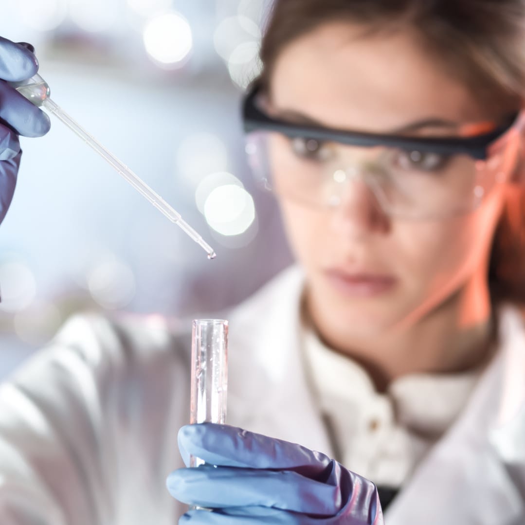 Female scientist testing ingredients for a skincare product