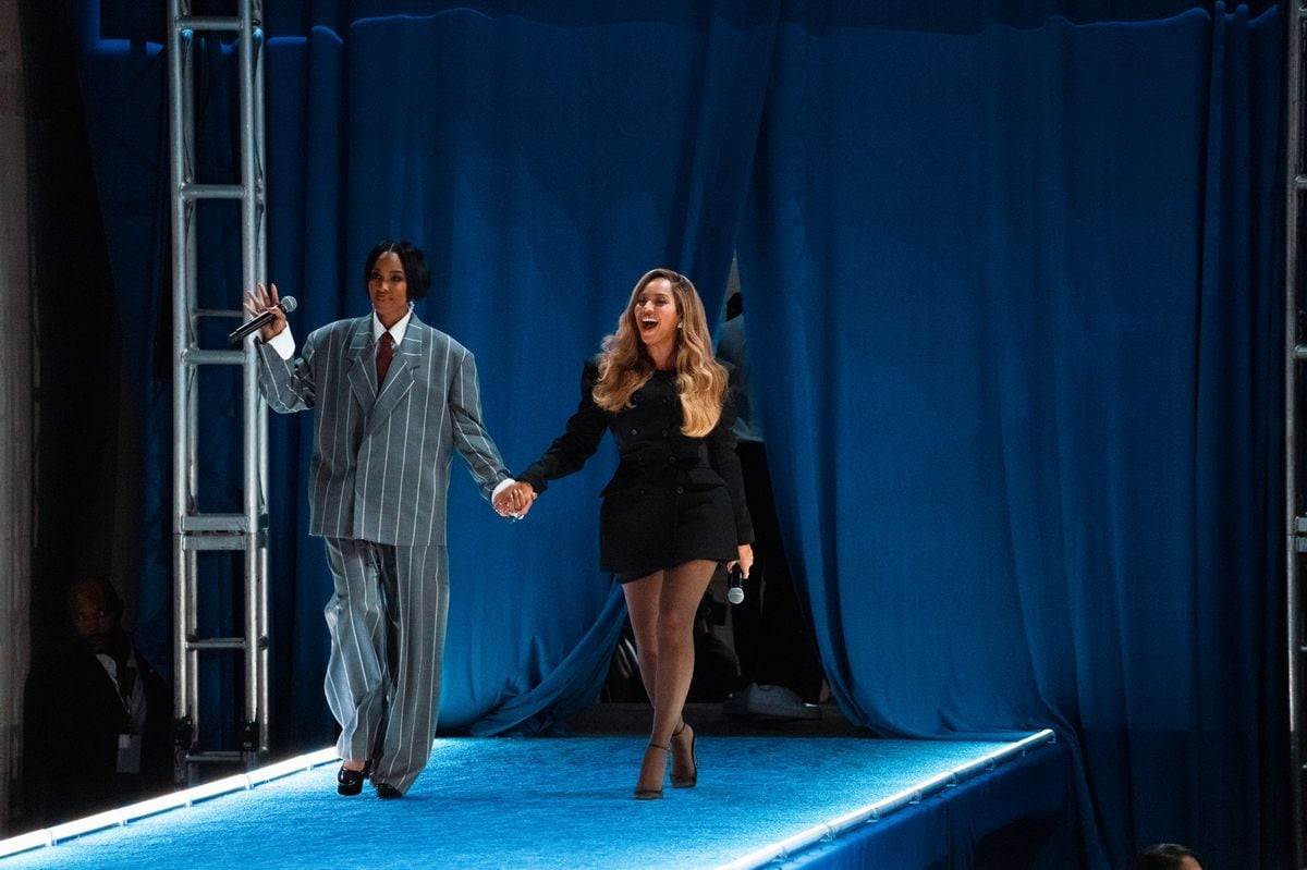 Kelly Rowland and Beyoncé walk onto the stage at a campaign rally for Democratic presidential nominee, Vice President Kamala Harris