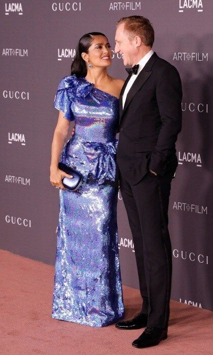 Sparkling and in love! Salma Hayek and her husband Francois-Henri Pinault couldn't keep their eyes off each other as they walked the star-studded carpet. The 51-year-old actress showcased her incredible hourglass figure in a single-sleeved glittering sapphire-sequin dress by Gucci. The Mexican-American star had VIP access to the Italian luxury designer, which sponsored the bash, thanks to her husband whose company Kering owns the brand.
Photo: Taylor Hill/Getty Images