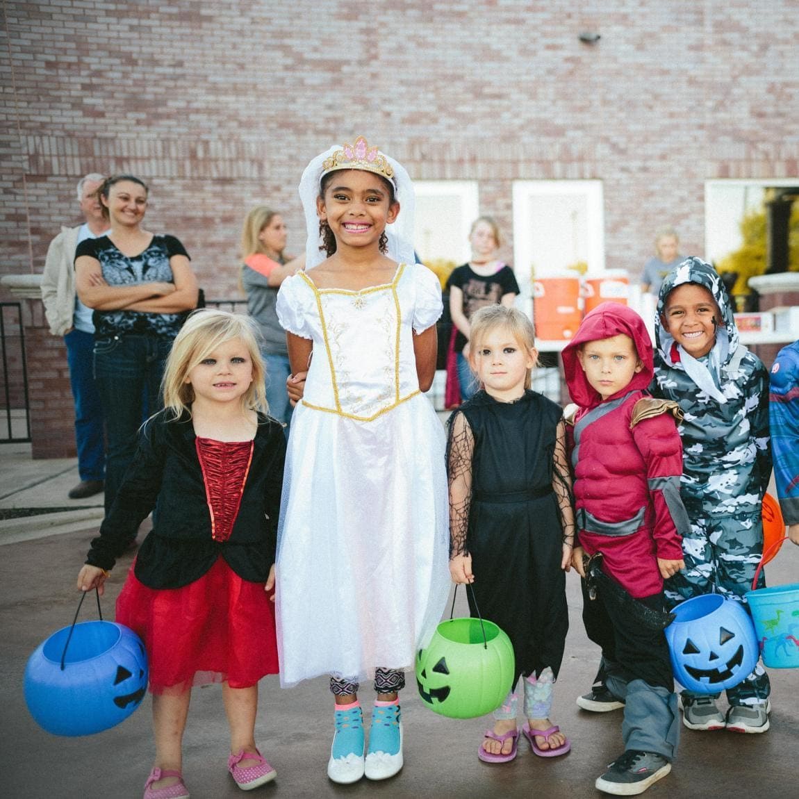 Children in costumes knock on people’s doors asking for candy