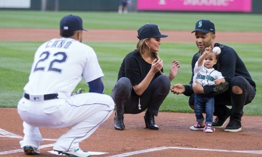 June 6: Play ball! John Legend and Chrissy Teigen's little girl, Luna tossed the first pitch to Robinson Cano #22 of the Seattle Mariners before his team saw the Minnesota Twins at their home field in Seattle.
Photo: Stephen Brashear/Getty Images