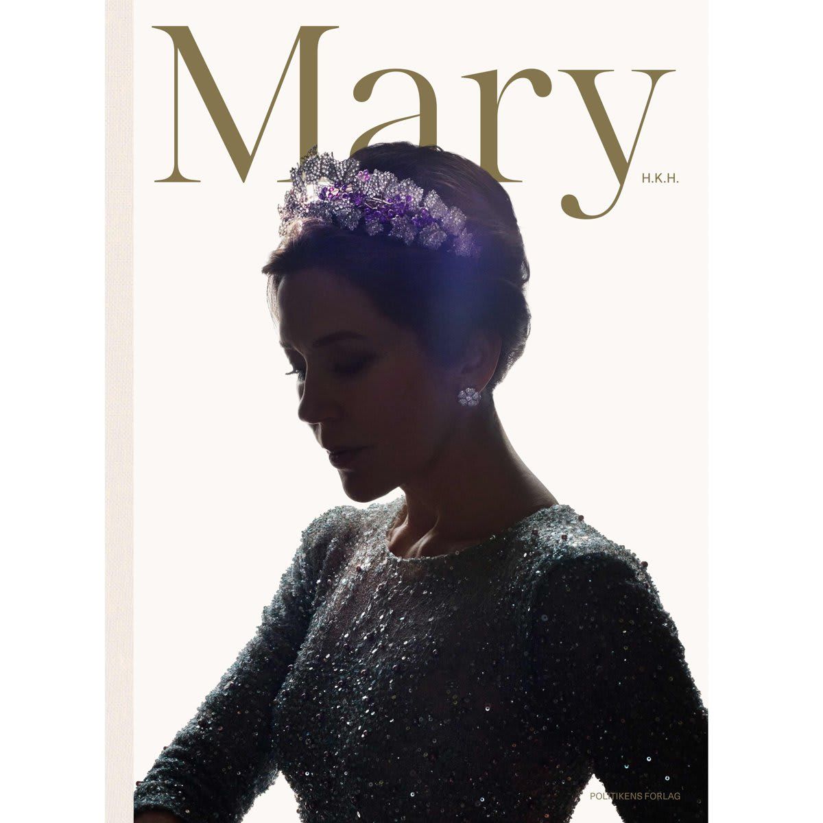 The cover of the upcoming book features a photo of Crown Princess Mary wearing a tiara