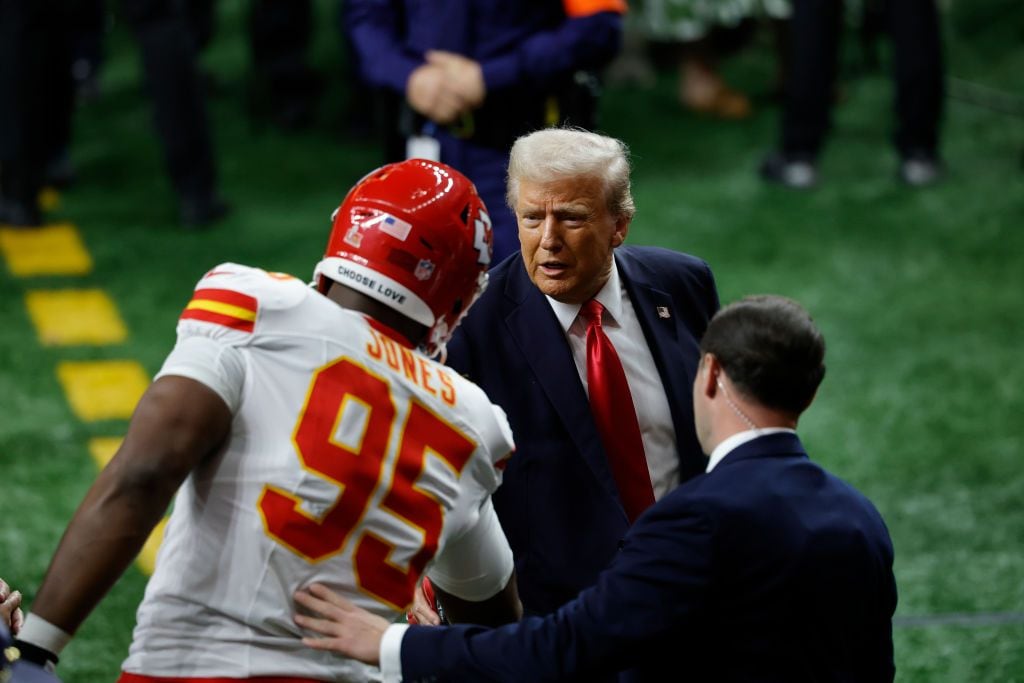 President Donald Trump shakes the hand of DT Chris Jones #95 of the Kansas City Chiefs during Super Bowl LIX between the Philadelphia Eagles and the Kansas City Chiefs on February 09, 2025, at the Caesars Superdome in New Orleans, LA. 