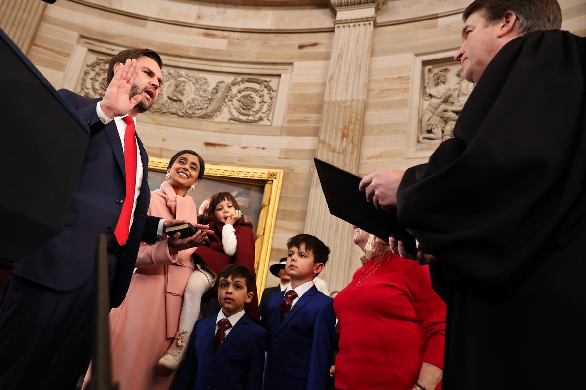 WASHINGTON, DC - JANUARY 20: U.S. Vice President-elect former Sen. J.D. Vance (R-OH) is sworn in by U.S. Supreme Court Associate Justice Brett Kavanaugh as his wife Usha Vance and his family look on during inauguration ceremonies in the Rotunda of the U.S. Capitol on January 20, 2025 in Washington, DC. Donald Trump takes office for his second term as the 47th president of the United States. (Photo by Chip Somodevilla/Getty Images)