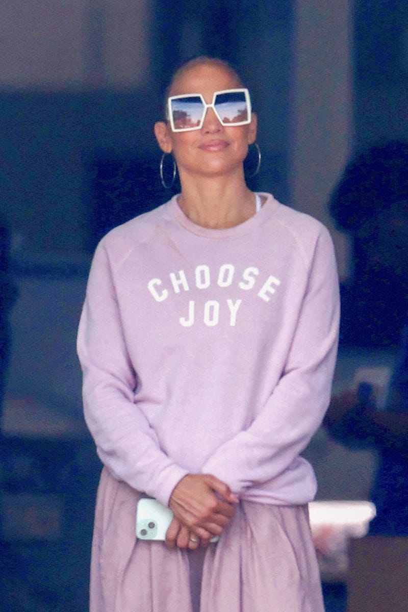Jennifer Lopez, looking pretty and comfy, is seen donning a pink sweater that says 'Choose Joy'. JLo spent some time with her son Max Muniz shopping at Best Buy in Riverhead. 