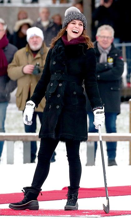 To kick off the tour in Stockhom, the pregnant Duchess stepped out onto the ice in Stockholm to play hockey wearing the perfect winter outfit: a cozy Burberry coat, sweater by Swedish designer Fjallraven, jeans and a knit Eugenia Kim pom pom hat. The royal's $130 'Torino' boots are by Sorem.
Photo: John Rainford/WENN.com