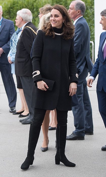 Duchess Kate was the epitome of elegant fall style on November 22 as she visited Birmingham, England for a day of engagements. The expectant royal recycled a black coat with military style details by British label Goat. Kate kept her jewelry simple with drop earrings by another favorite, Kiki McDonough.
Photo: Getty Images