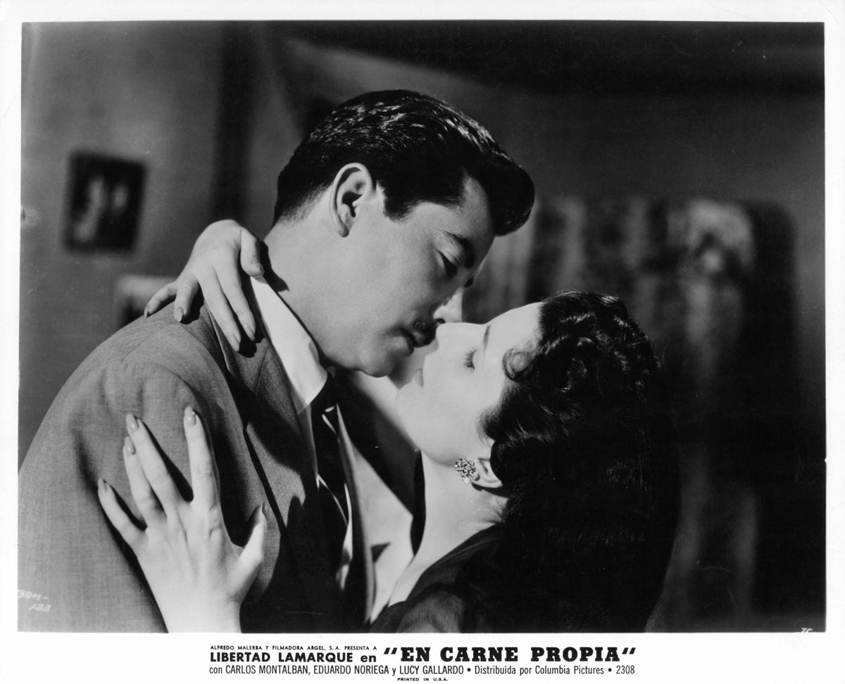 Eduardo Noriega and Libertad Lamarque about to kiss in a scene from the film 'En Carne Propia', 1961. (Photo by Columbia Pictures/Getty Images)