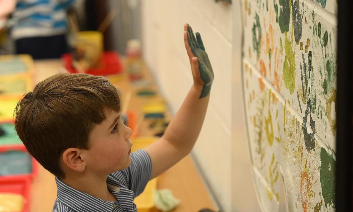 The Prince left his mark, while hand painting on a wall.