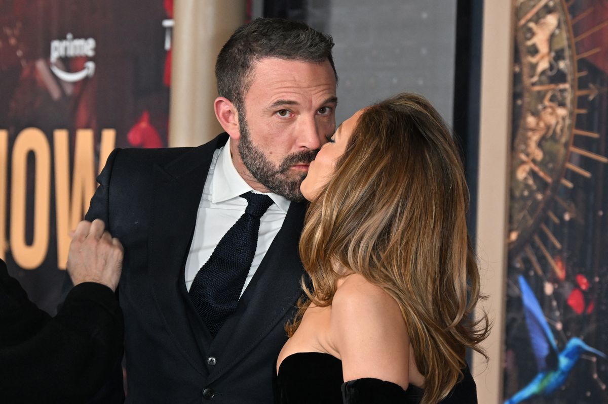 Jennifer Lopez (R) and US actor Ben Affleck kiss as they attend Amazon's "This is Me... Now: A Love Story" premiere at the Dolby Theatre in Hollywood, California, February 13, 2024. (Photo by Robyn BECK / AFP) (Photo by ROBYN BECK/AFP via Getty Images)