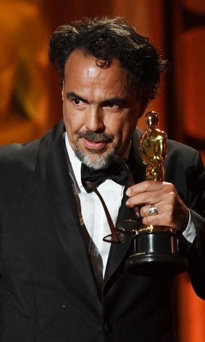 Alejandro Gonzalez Inarritu received a Special Award Oscar at the November ceremony, a prize that is rarely given out. The Academy's committee decided to recognize Alejandro's newest venture CARNE Y ARENA (translation: Meat and Sand), which premiered at the 2017 Cannes festival. Aiming to throw "viewers into the harsh life of an immigrant," the project is a virtual reality installation at LACMA. The 54-year-old Mexican film director and screenwriter gave a moving speech upon his acceptance of the award.
Photo: ROBYN BECK/AFP/Getty Images