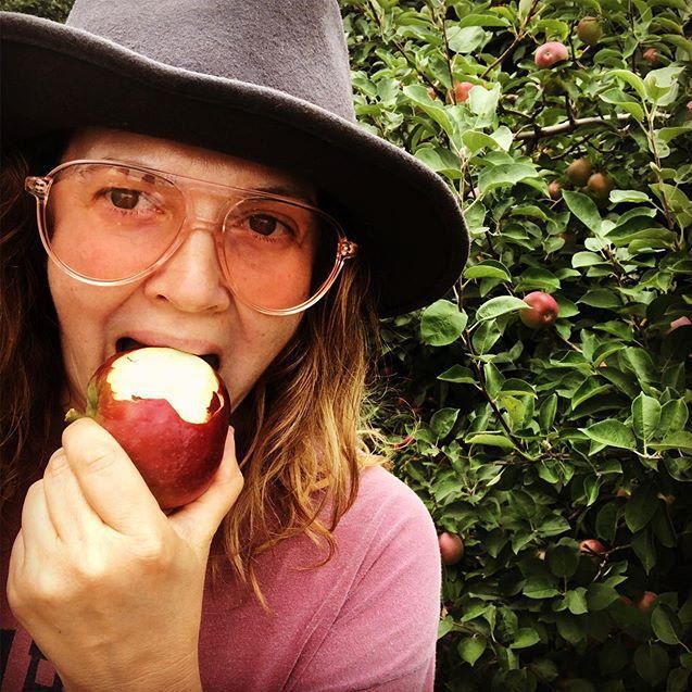 Drew Barrymore eating an apple