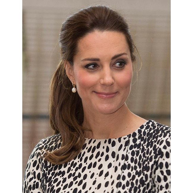 A few weeks before she welcomed Princess Charlotte into the world, Kate made quite the impression with her chic dalmatian-print coat dress by Hobbs and an effortless ponytail.
<br>
Photo: Getty Images