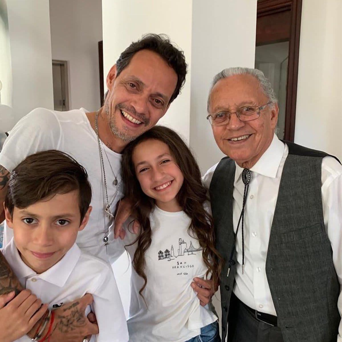 Marc Anthony poses with dad, Max and Emme