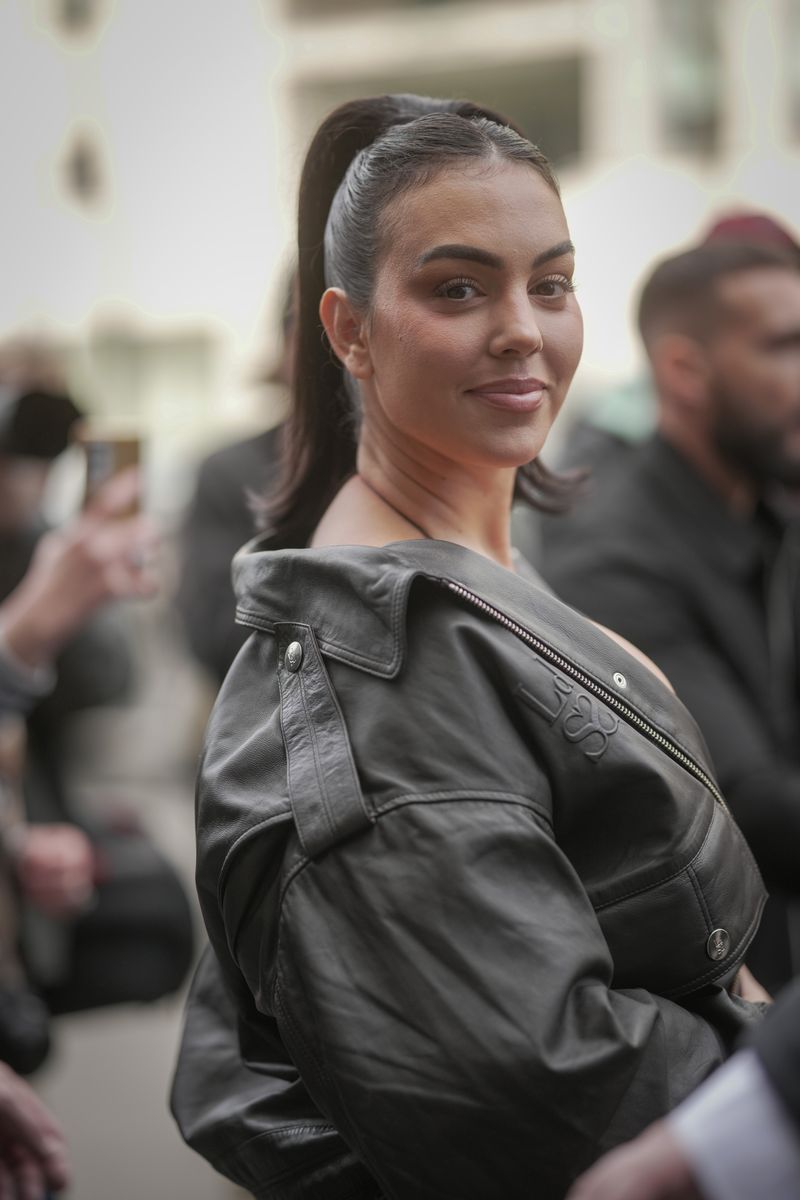 Georgina Rodriguez wears a black leather jacket and a corset during the Womenswear Fall/Winter 2025/2026