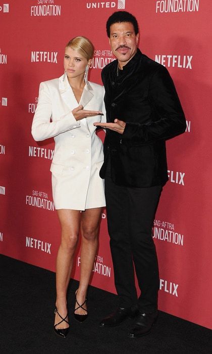 Sofia Richie supported her dad at the SAG-AFTRA Foundation's Patron of the Artists Awards held at the Wallis Annenberg Performing Arts Center in Beverly Hills on November 9.
While walking the carpet, the two spoke about the 19-year-old's dating life. "He's good. He's been very nice. He's been very cool," Sofia, who has been recently linked to Scott Disick shared to E! News. "He's very supportive, whatever that means," As she was speaking, the <i>All Night Long</i> singer jokingly made hand gesture shooting himself in the head.
He did chime in, "I am into her business, and she's trying to keep me out of her business," he said in the same interview. "The fact is, I don't know, how can you sneak when everything is on Instagram?"
Photo: Getty Images