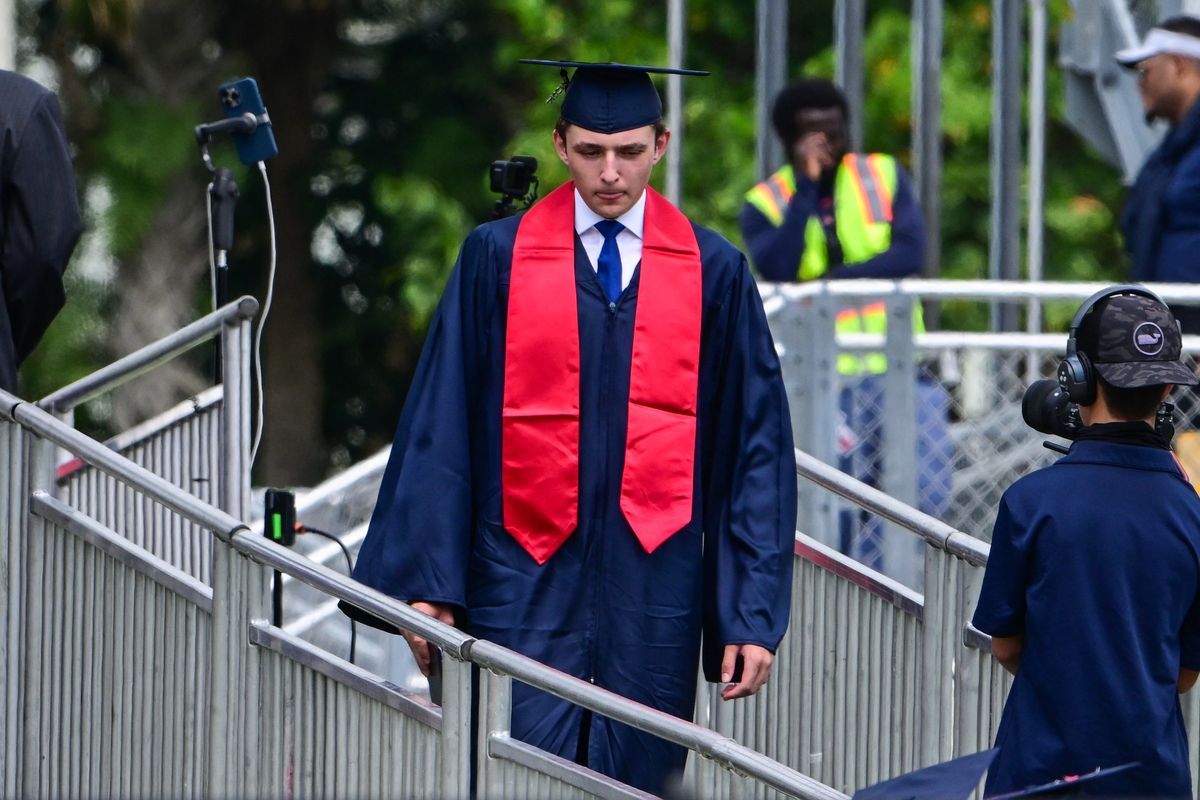 Barron Trump takes part in his graduation at Oxbridge Academy in Palm Beach, Florida.