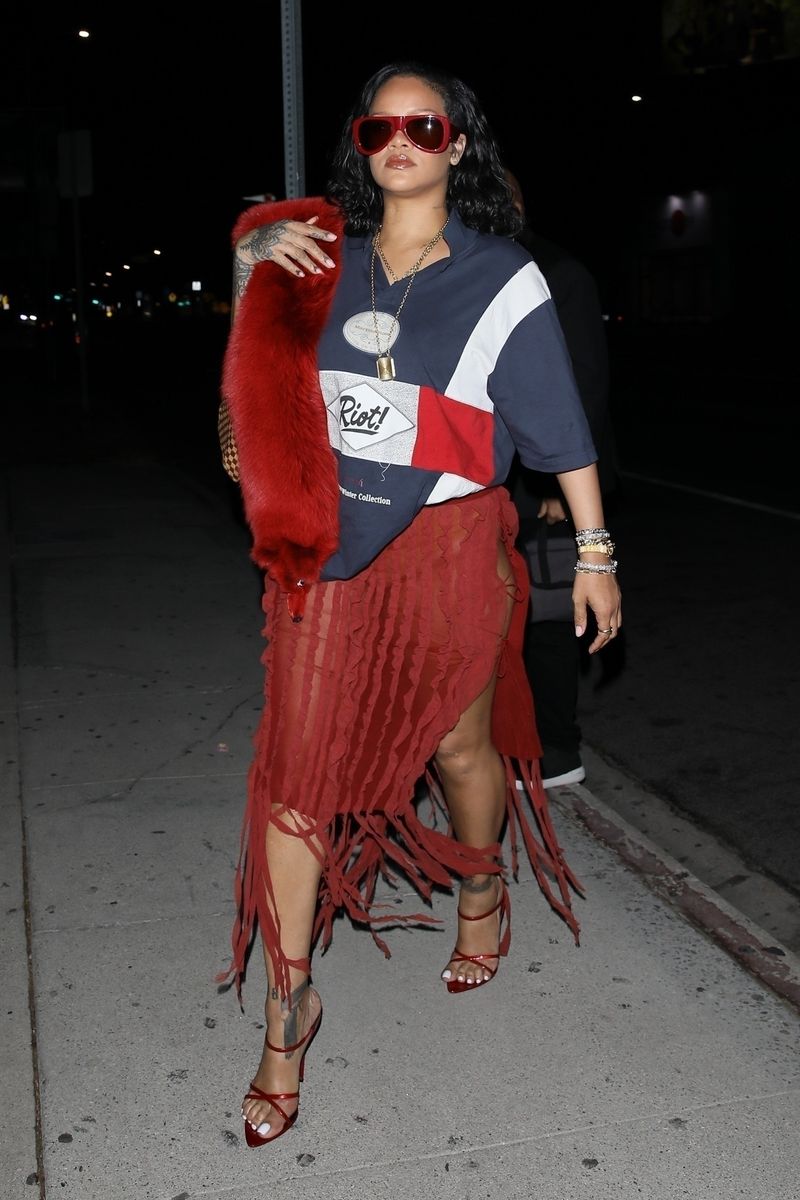 Photo Â© 2024 Backgrid/The Grosby Group
EXCLUSIVE 
West Hollywood, November 13, 2024
Rihanna turned heads at The Nice Guy in West Hollywood, rocking a skin-baring dress that highlighted her curves, paired with a Martine-Rose shirt featuring her son's name "Riot". The singer turned businesswoman effortlessly blended sultry style with a personal touch -- proving once again she's the ultimate fashion risk-taker.