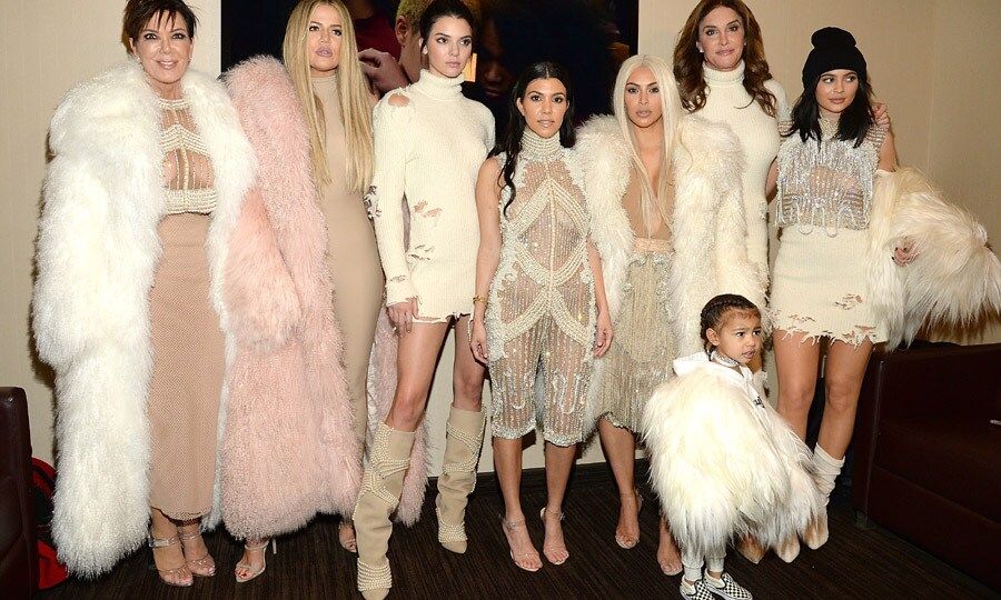 <b>February 2016</b>
<br>
With sharp braids and oversized fur, North is right at home amongst the Kardashian clan as they pose for a picture at the Yeezy fashion show. We love that she's wearing a simple pair of checkered Vans with the fancy outfit.
</br><br>
Photo: Getty Images