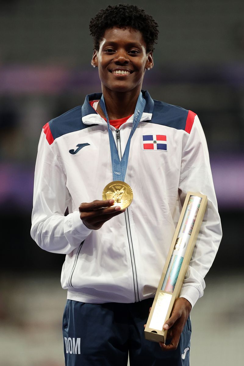 Gold medalist Marileidy Paulino of Team Dominican Republic celebrates on the podium during the Women's 400m medal ceremony on day fourteen of the Olympic Games Paris 2024 at Stade de France on August 09, 2024 in Paris, France. (Photo by Patrick Smith/Getty Images)