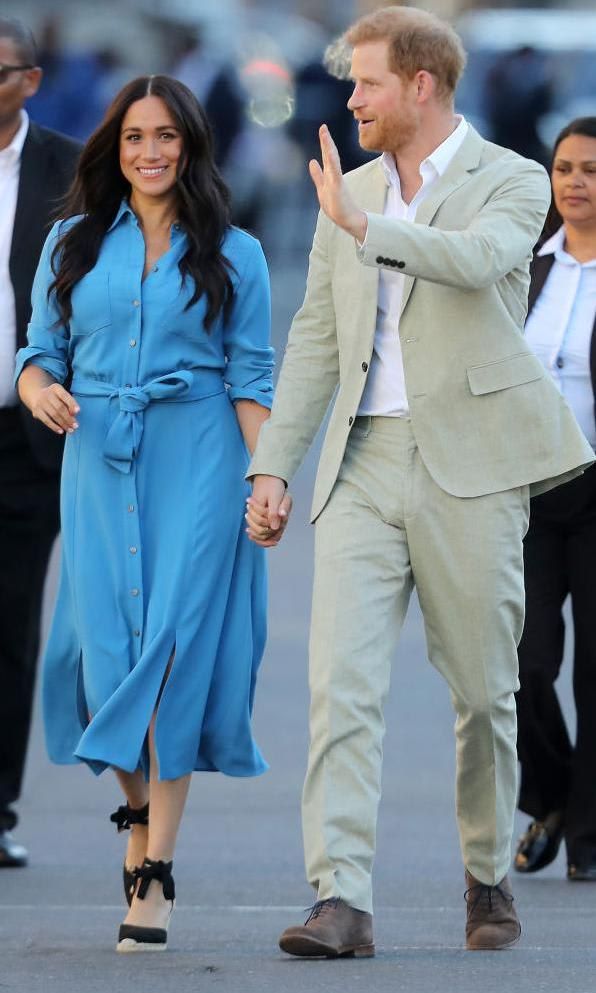 Meghan Markle with blue midi shirt dress by Veronica Beard.