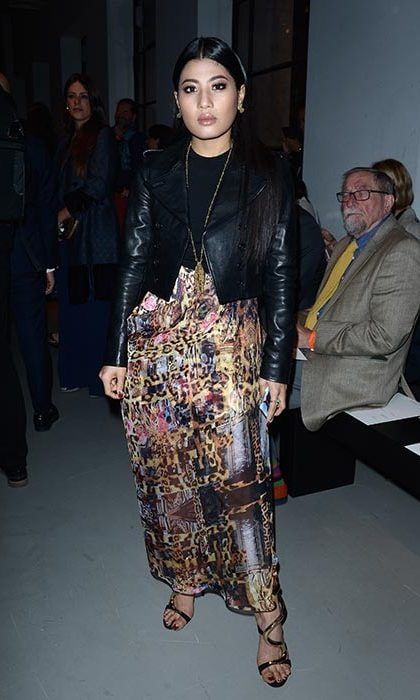 Thailand's princess showed off her style credentials in a multi-colored patterned maxi skirt paired with a black top and leather jacket at the John Galliano show.
<br>
Photo: Getty Images