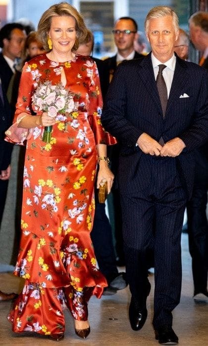 After a week of stylish appearances, Queen Mathilde managed to thrill fashionistas everywhere yet again as she arrived to the Prelude to the National Day Concert at Palais des Beaux-Arts on July 20 in Brussels, Belgium with her husband King Philip. The 45-year-old royal sizzled in a burnt orange satin gown that featured a high neckline with a teardrop opening in the center.
Photo: Getty Images