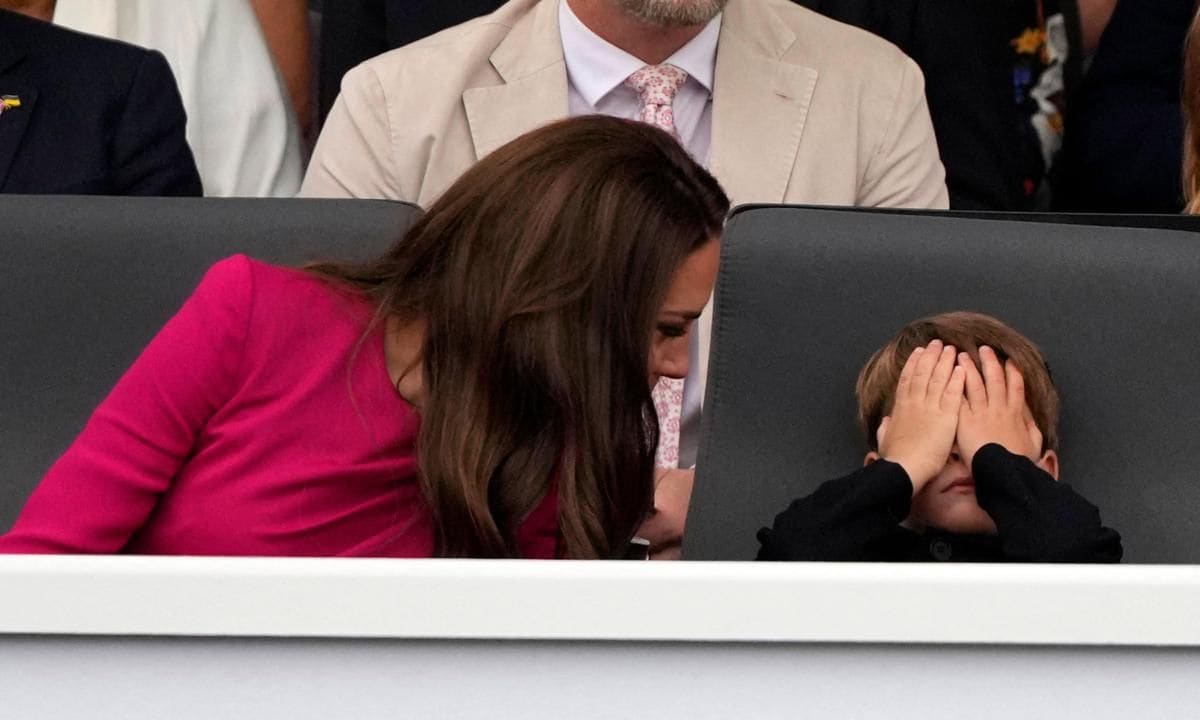 Tired, Louis? The Prince was snapped covering his face during the pageant.