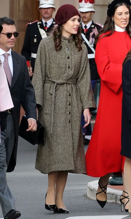 Fashion darling Charlotte Casiraghi daughter of Princess Caroline channeled the 1920s in a brown coat, patent leather shoes and a burgundy cloche hat embellished with a large flower detail. She also wore her hair in long ringlets, adding even more vintage allure to the look.
Photo: Getty Images