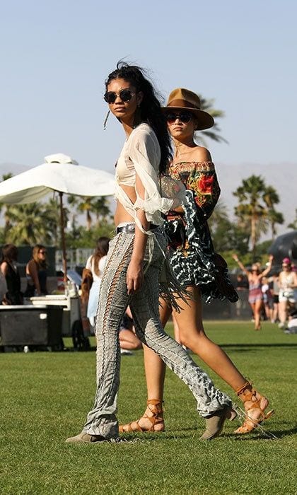 <b>Chanel Iman</B> showed off her toned stomach in a loose white crop top and laced-up jeans.
<br>
Photo: Getty Images