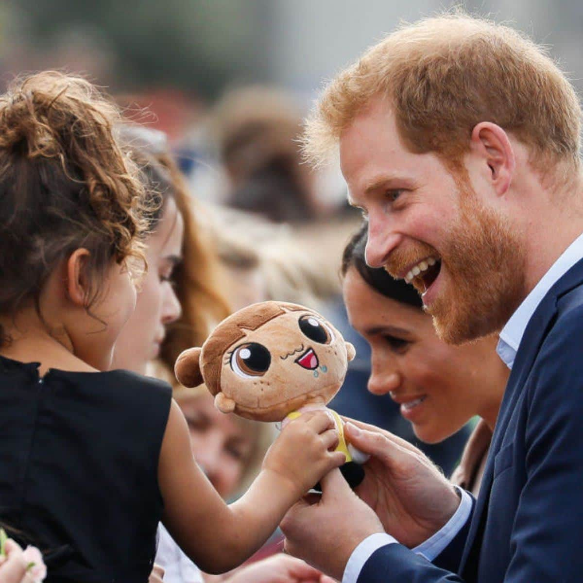 Prince Harry interacts with children