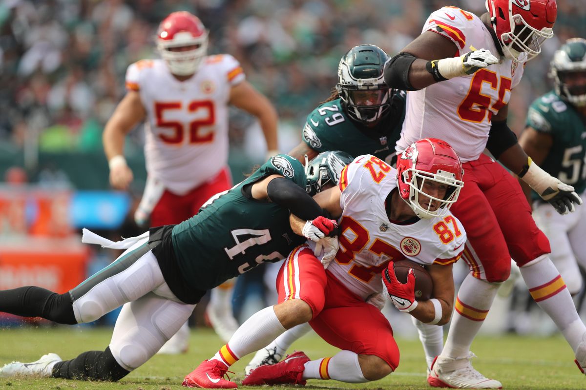 PHILADELPHIA, PA - OCTOBER 3: Travis Kelce #87 of the Kansas City Chiefs is tackled by Alex Singleton #49 of the Philadelphia Eagles during an NFL football game against the Philadelphia Eagles at Lincoln Financial Field on October 3, 2021 in Philadelphia, Pennsylvania. (Photo by Perry Knotts/Getty Images) 