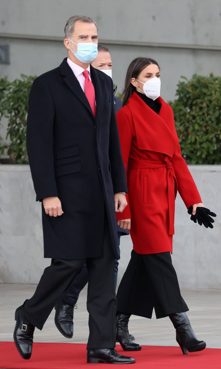 Queen Letizia looked stylish in a red coat as she and King Felipe left for Sweden on Nov. 23