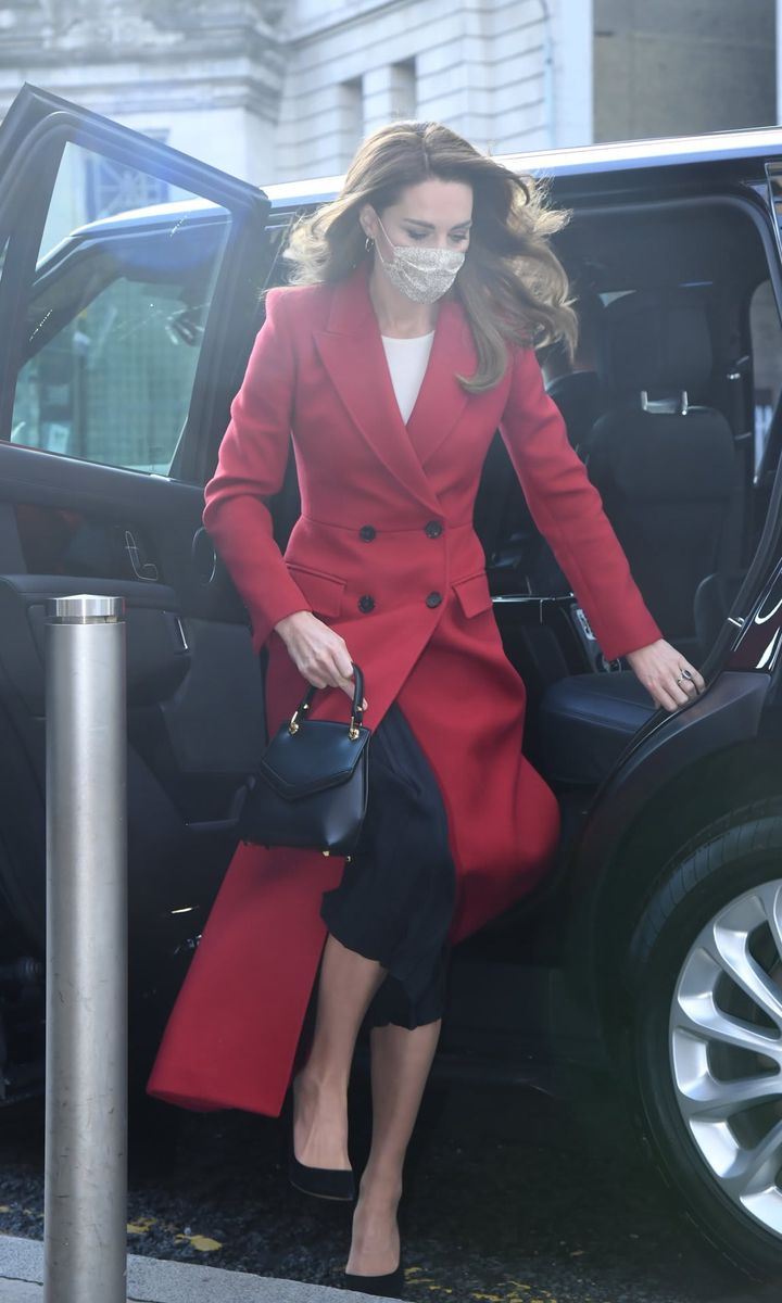 Kate looked radiant wearing a red Alexander McQueen coat